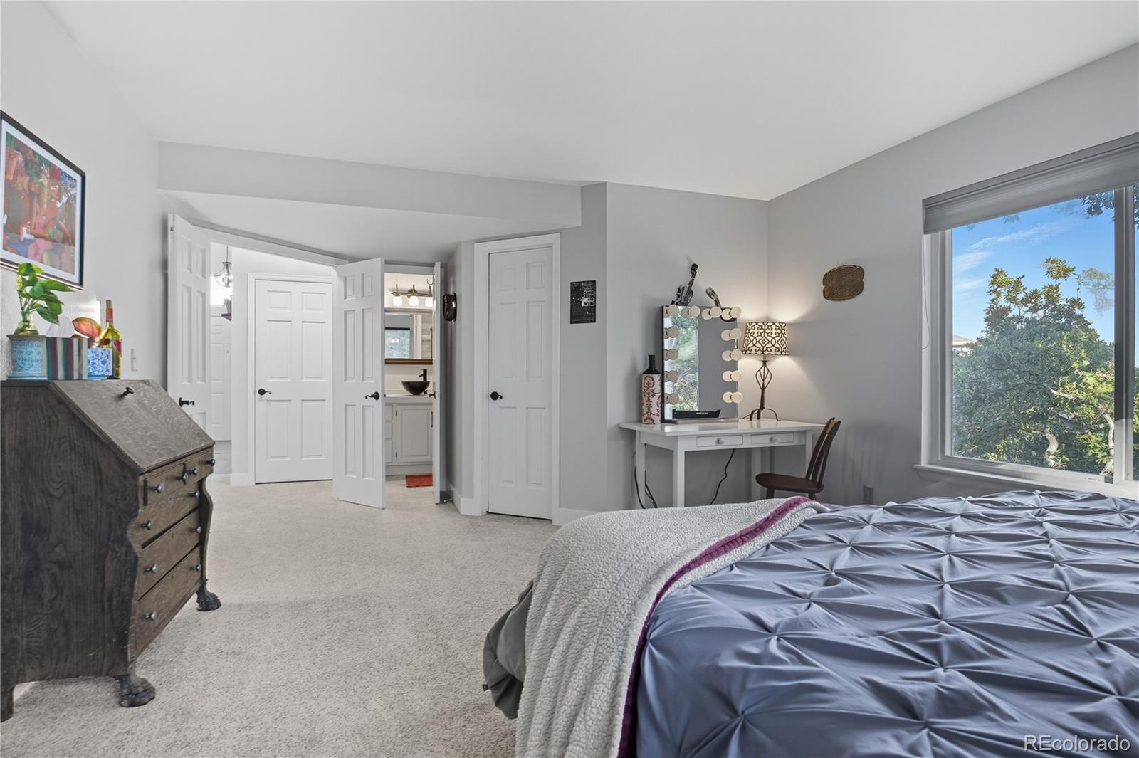 35 Ravenglass Way Colorado Springs, CO 80906 - Photo 24 of 45 a bedroom with a bed and a window