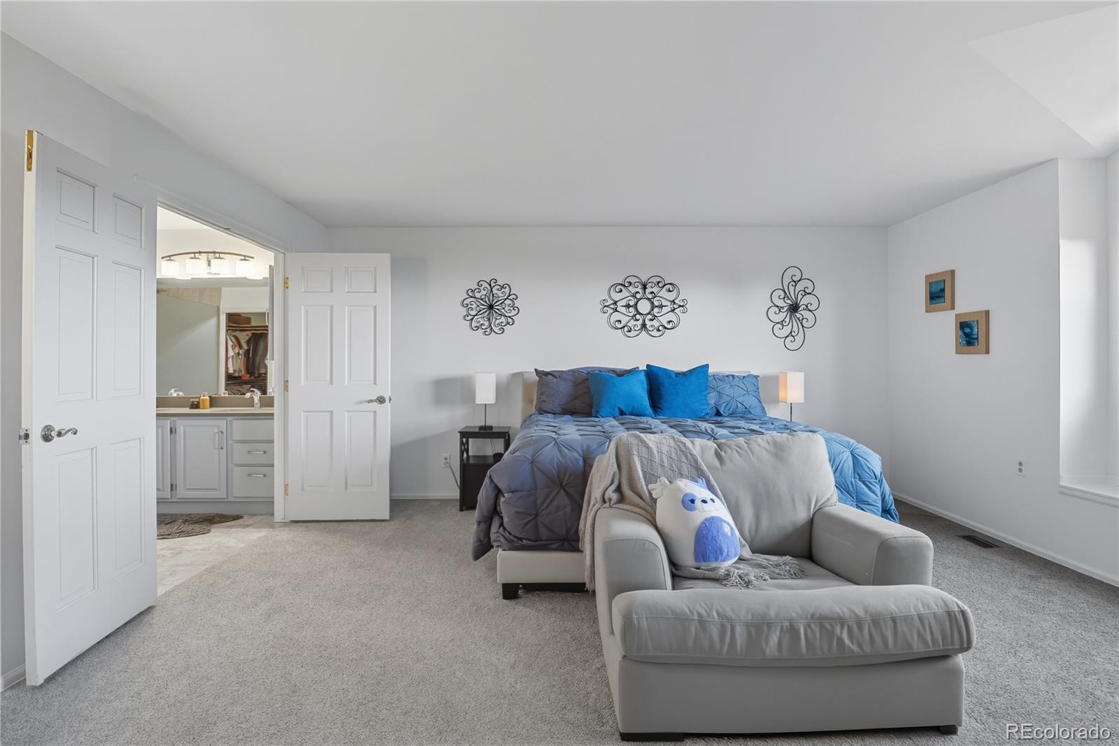 35 Ravenglass Way Colorado Springs, CO 80906 - Photo 25 of 45 a bedroom with furniture and a couch