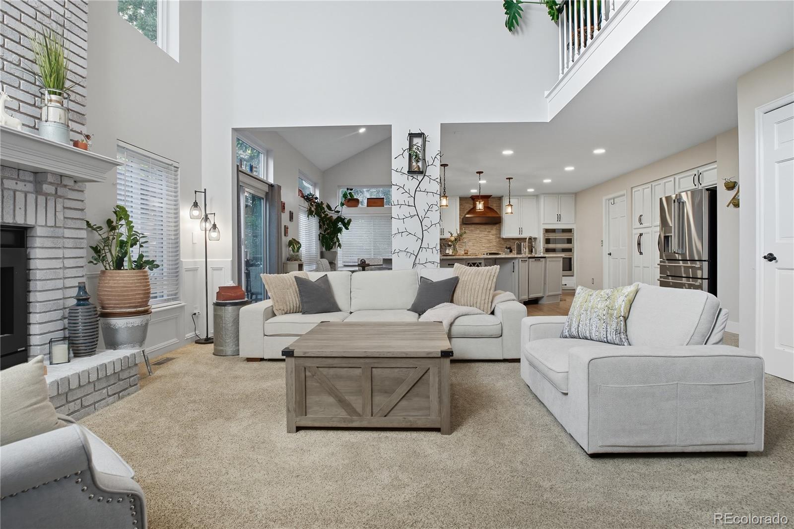 35 Ravenglass Way Colorado Springs, CO 80906 - Photo 3 of 45 a living room with furniture and a large window