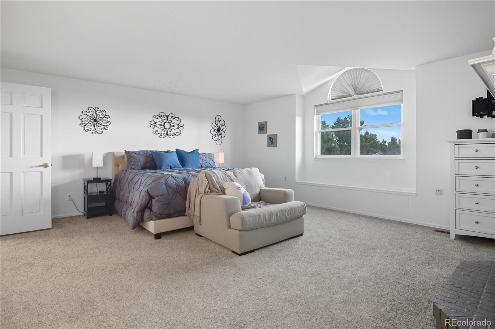 35 Ravenglass Way Colorado Springs, CO 80906 - Photo 32 of 45 a living room with furniture a bed and a window