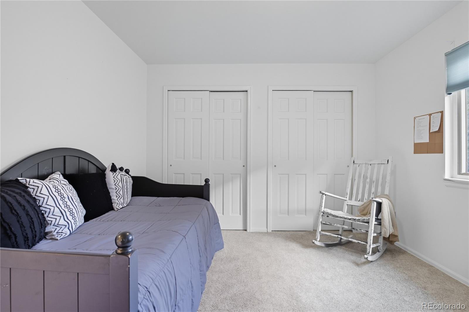 35 Ravenglass Way Colorado Springs, CO 80906 - Photo 33 of 45 a bedroom with a bed and a window