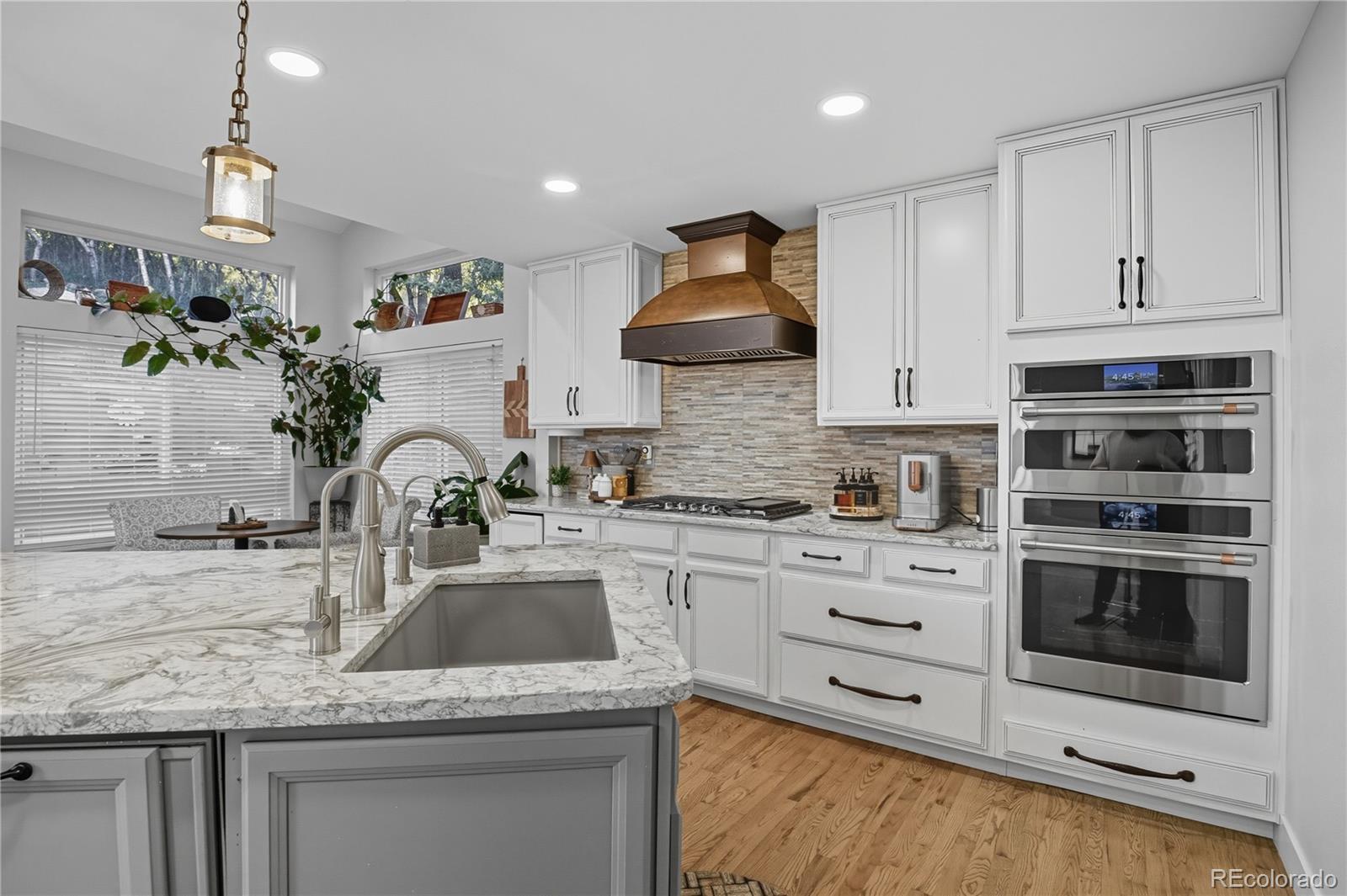35 Ravenglass Way Colorado Springs, CO 80906 - Photo 6 of 45 a kitchen with stainless steel appliances granite countertop a sink stove and cabinets
