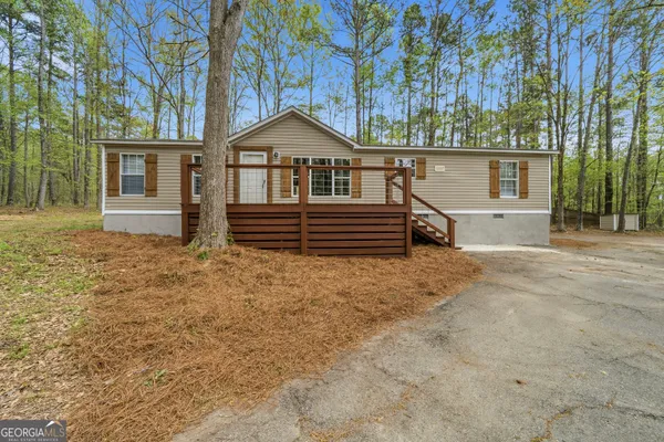 a view of house with trees in the background