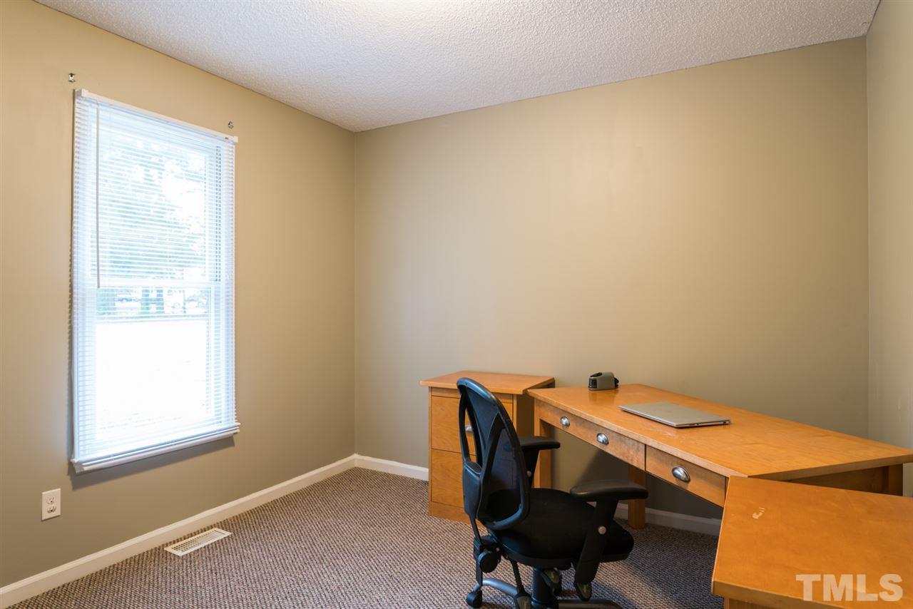 6016 Shadow Moss Circle Raleigh, NC 27603 - Photo 14 of 16 a room with a desk and a window