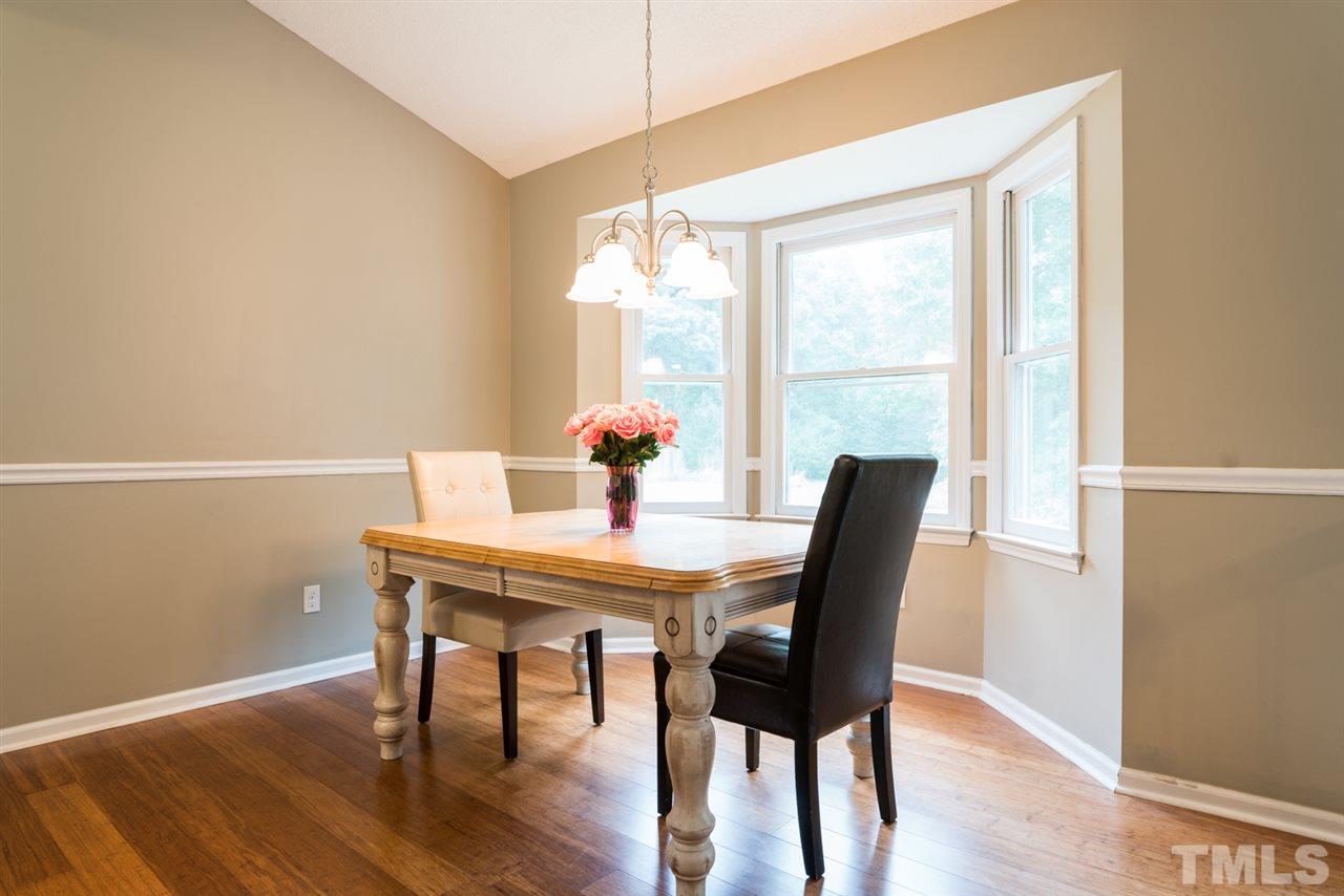 6016 Shadow Moss Circle Raleigh, NC 27603 - Photo 5 of 16 a view of a dining room with furniture window and outside view