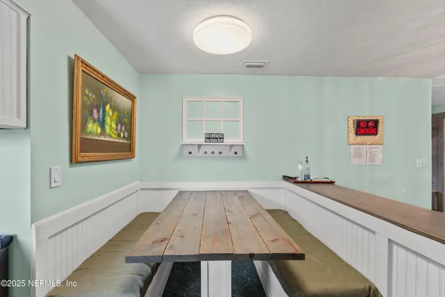 a bedroom with a bed and a table in it