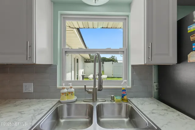 a bedroom with a bed and a bookshelf