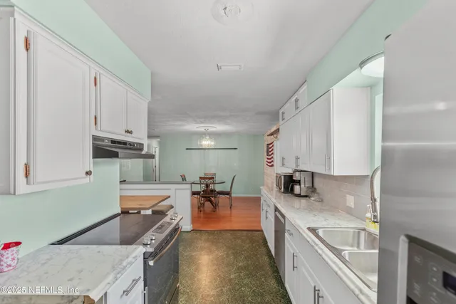 a bedroom with bed and a window