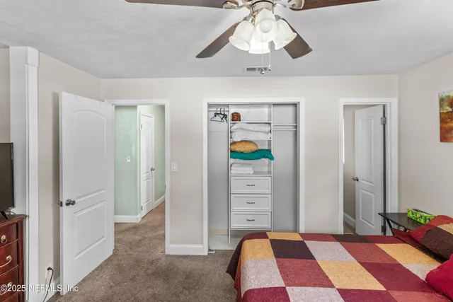 a view of a hallway with seating area