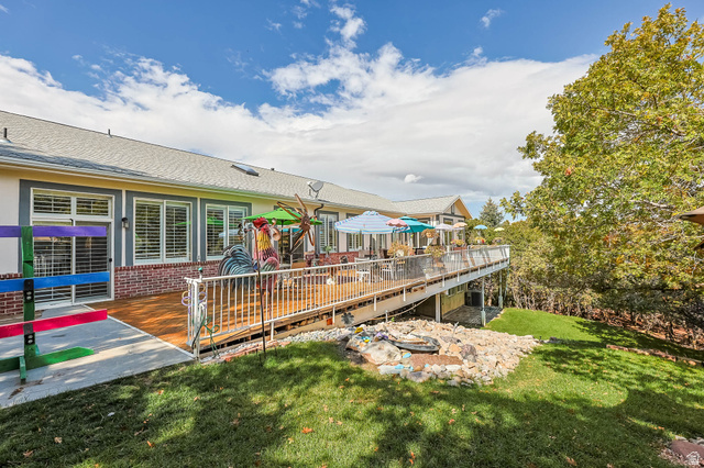 569 Elk Meadow Loop Tooele, UT 84074 - Photo 7 of 56 Wooden terrace featuring a lawn