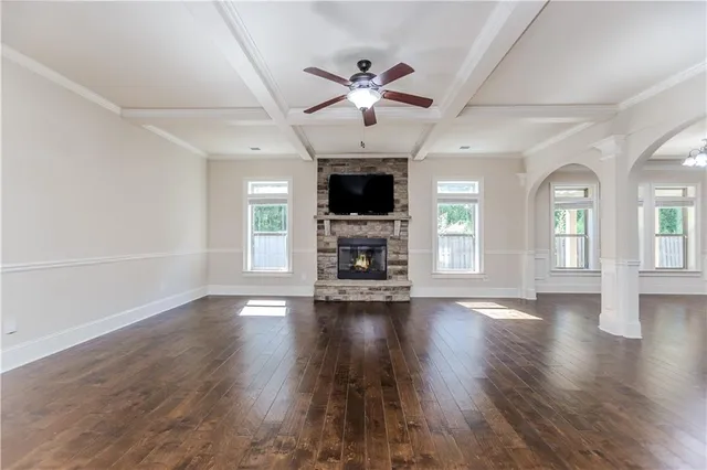 a large kitchen with stainless steel appliances granite countertop a stove a sink and a wooden floors