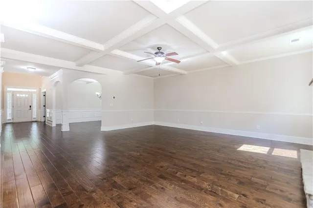 a large kitchen with stainless steel appliances granite countertop a stove a sink and a wooden floors