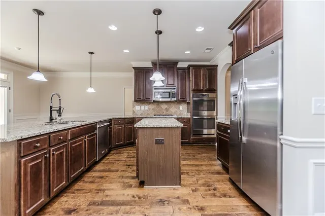 a kitchen with a table and chairs