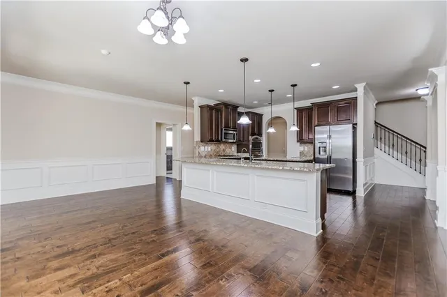 a view of a livingroom with a ceiling fan and window