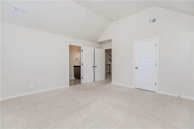 a bathroom with a sink a toilet a mirror and shower