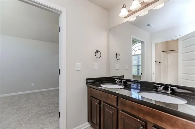 a view of a patio with a dining table and chairs