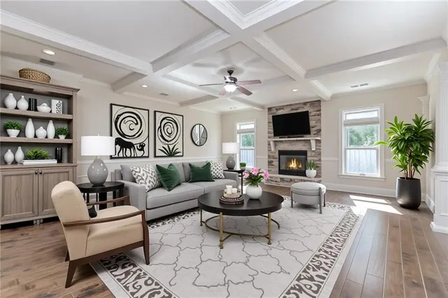 a living room with furniture fireplace and a potted plant
