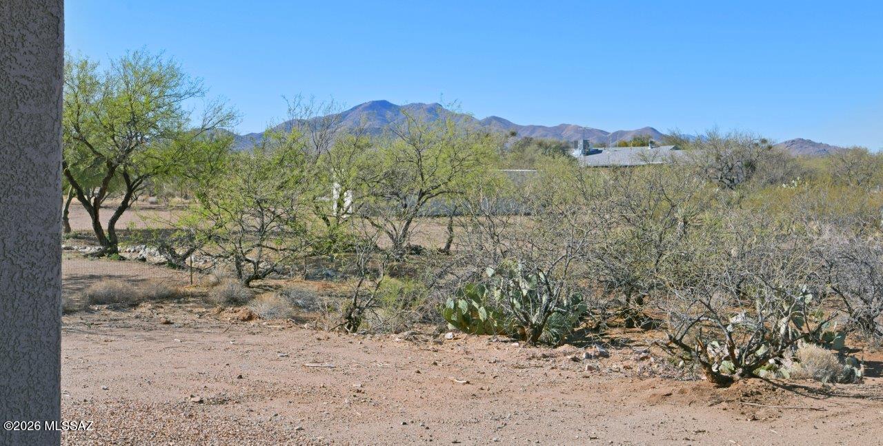 1091 North Vail View Road Vail, AZ 85641 - Photo 34 of 43 a view of a dry yard with mountains in the background