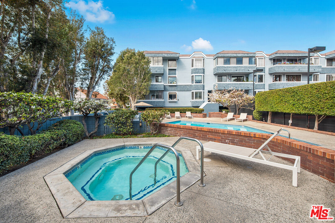 311 Bora Bora Way, Unit 3207 Marina del Rey, CA 90292 - Photo 50 of 54 a view of a swimming pool with a lounge chairs