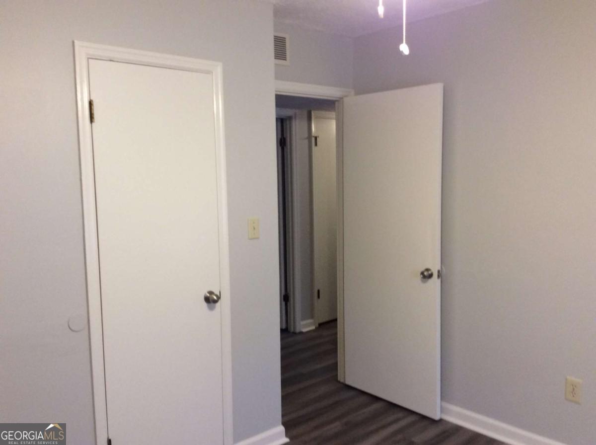 106 Richard Way Stockbridge, GA 30281 - Photo 13 of 15 a view of a hallway with wooden floor