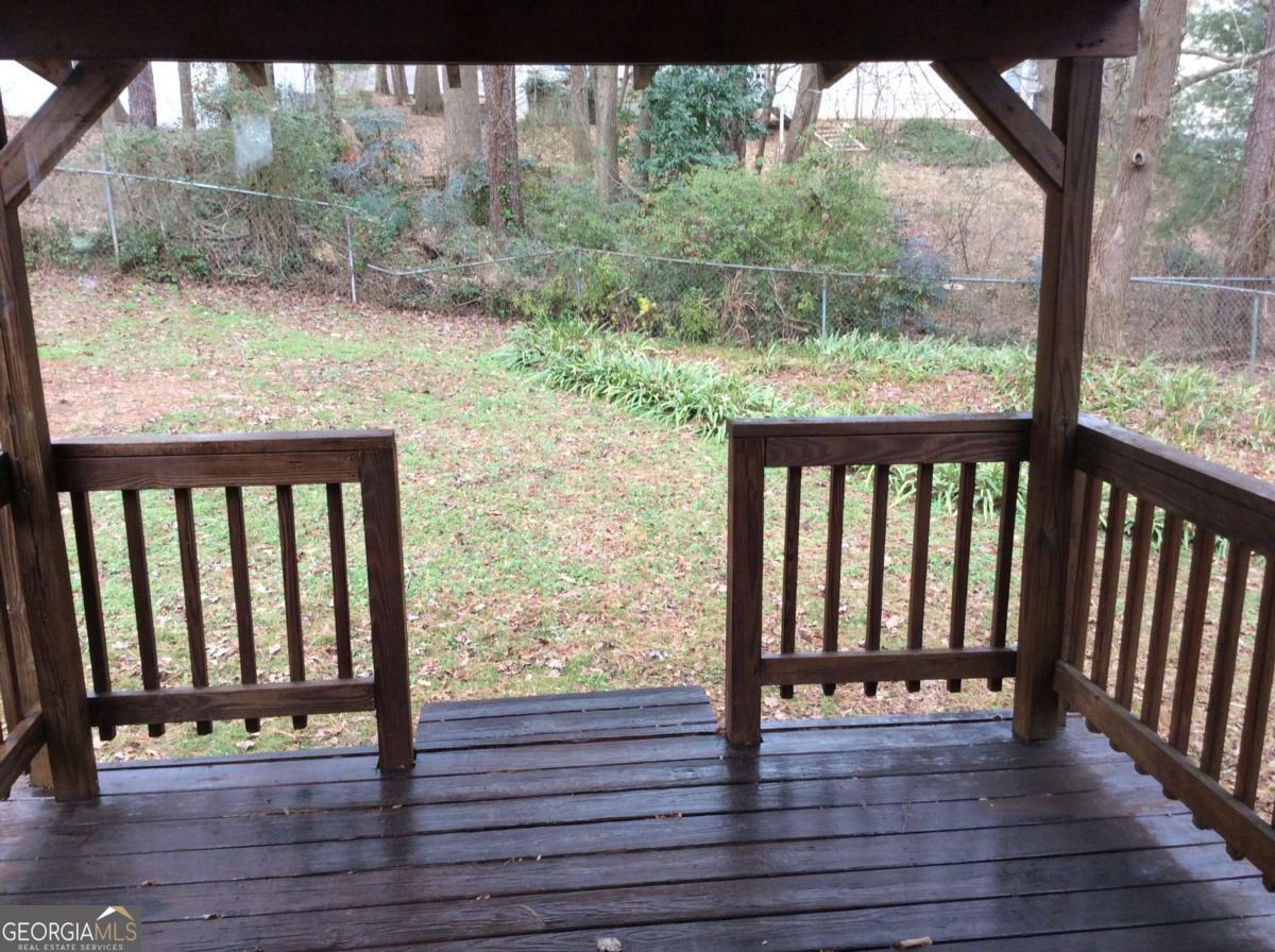 106 Richard Way Stockbridge, GA 30281 - Photo 9 of 15 a view of porch with wooden floor