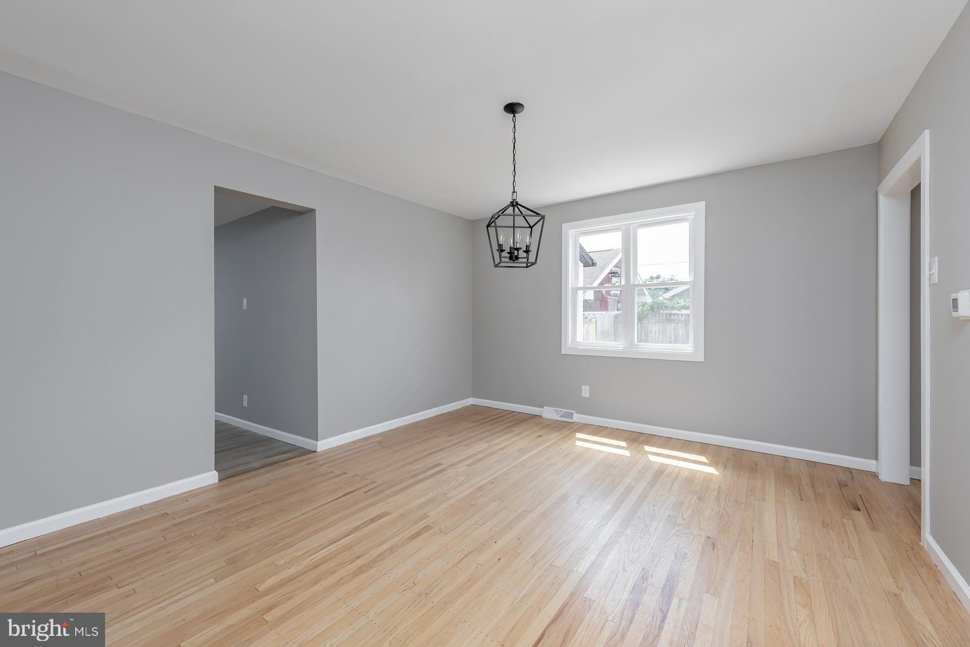 1308 Maple Avenue Glendora, NJ 08029 - Photo 11 of 22 wooden floor in an empty room with a window