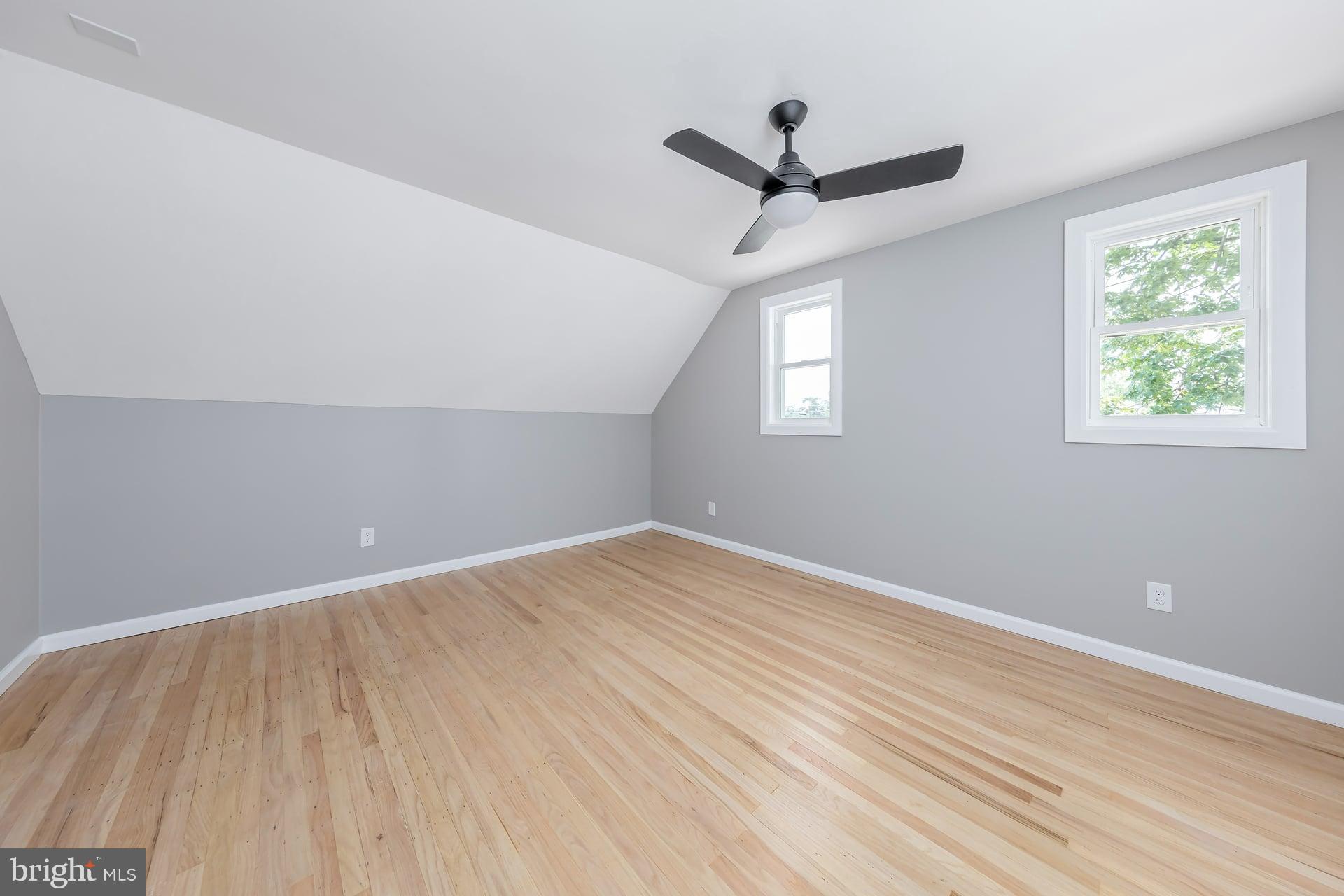 1308 Maple Avenue Glendora, NJ 08029 - Photo 16 of 22 wooden floor in an empty room with a window