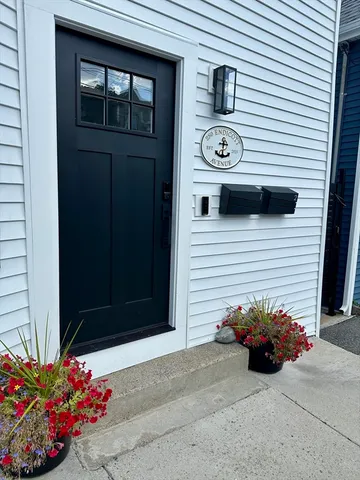 a view of a entryway door front of a house