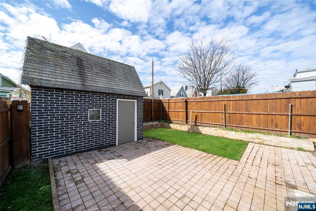 46 East 16th Street Bayonne, NJ 07002 - Photo 19 of 24 a view of backyard with wooden fence