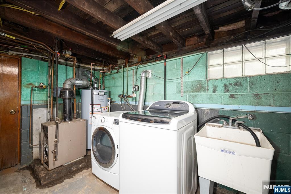 46 East 16th Street Bayonne, NJ 07002 - Photo 22 of 24 a utility room with dryer and washer