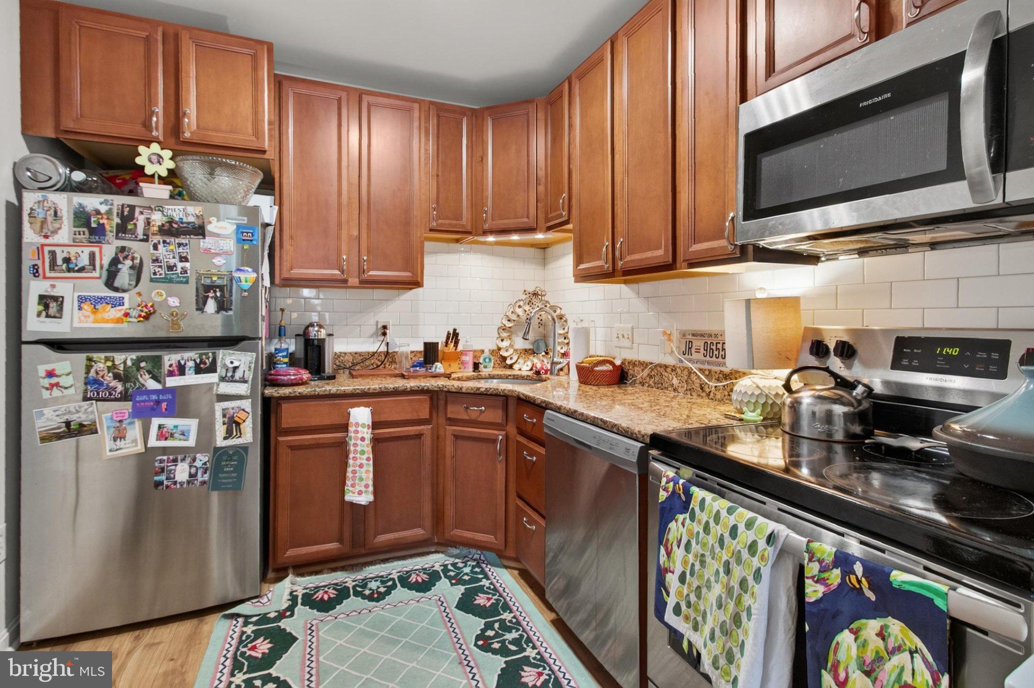 738 11th Street Northeast, Unit 1 Washington, DC 20002 - Photo 12 of 21 Cozy kitchen with warm wooden tones.