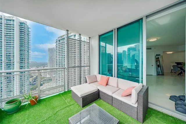 a view of swimming pool with outdoor seating