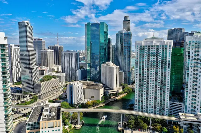 a swimming pool with outdoor seating and a garden