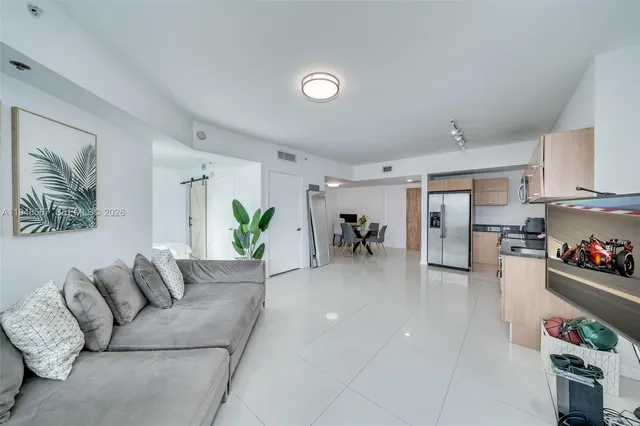 a living room with furniture flowerpot and a living room