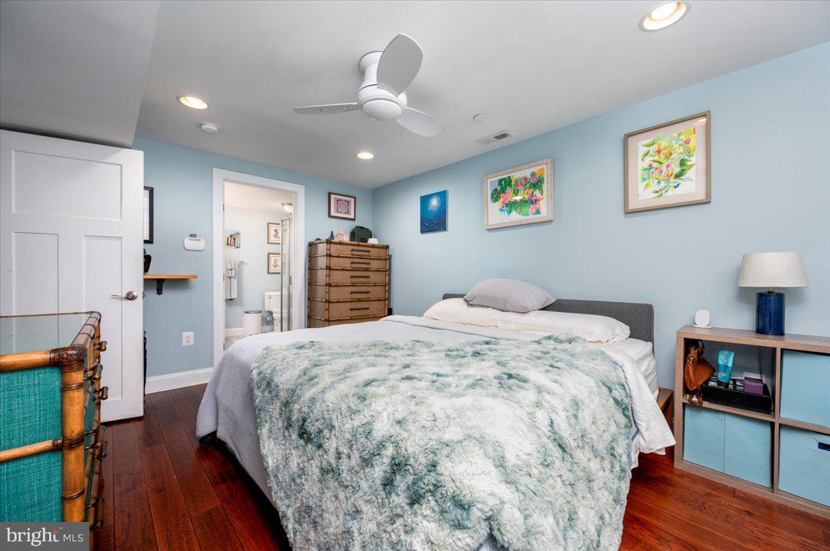 57 Spa Road Annapolis, MD 21401 - Photo 22 of 39 a bedroom with a bed and a wooden floor