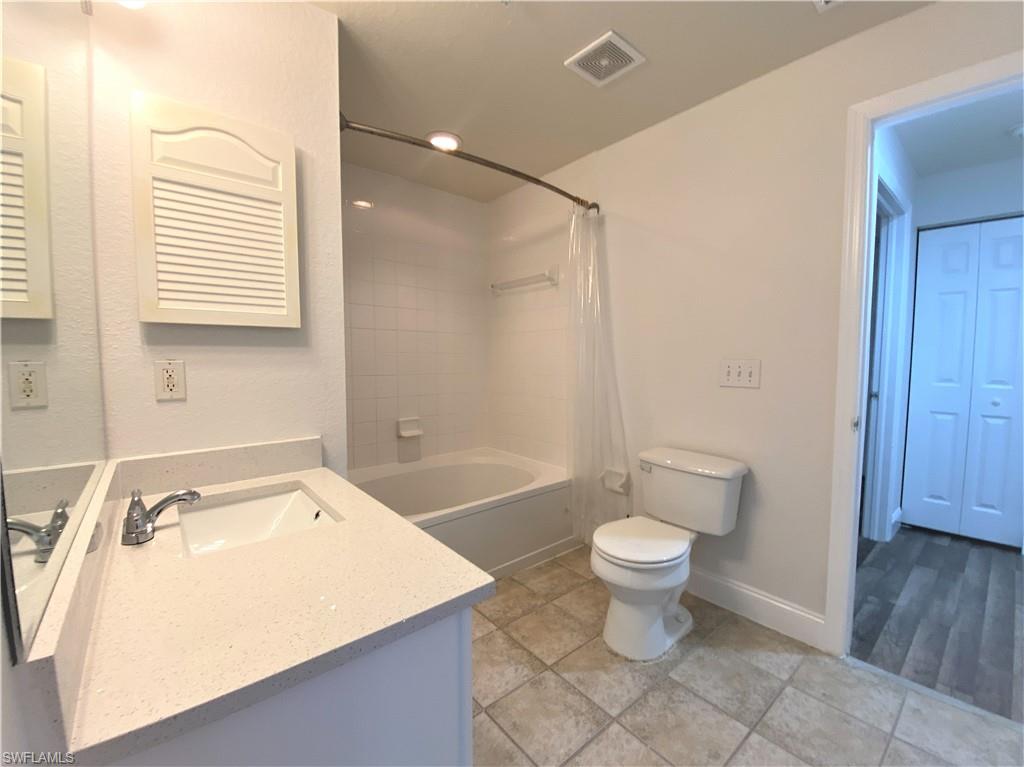 7960 Preserve Circle, Unit 616 Naples, FL 34119 - Photo 15 of 20 a bathroom with a sink a toilet and a bathtub