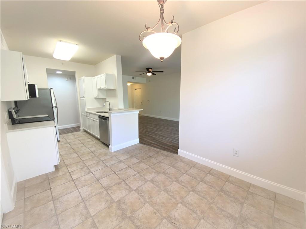 7960 Preserve Circle, Unit 616 Naples, FL 34119 - Photo 6 of 20 a view of a kitchen with a sink
