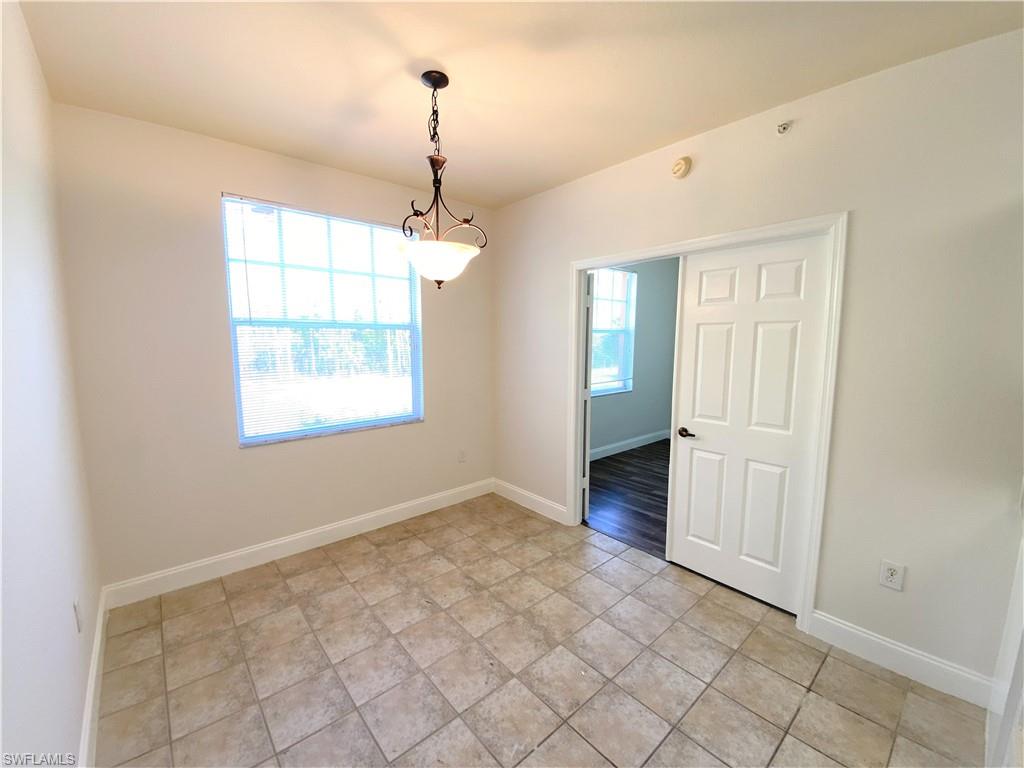 7960 Preserve Circle, Unit 616 Naples, FL 34119 - Photo 8 of 20 an empty room with windows and closet