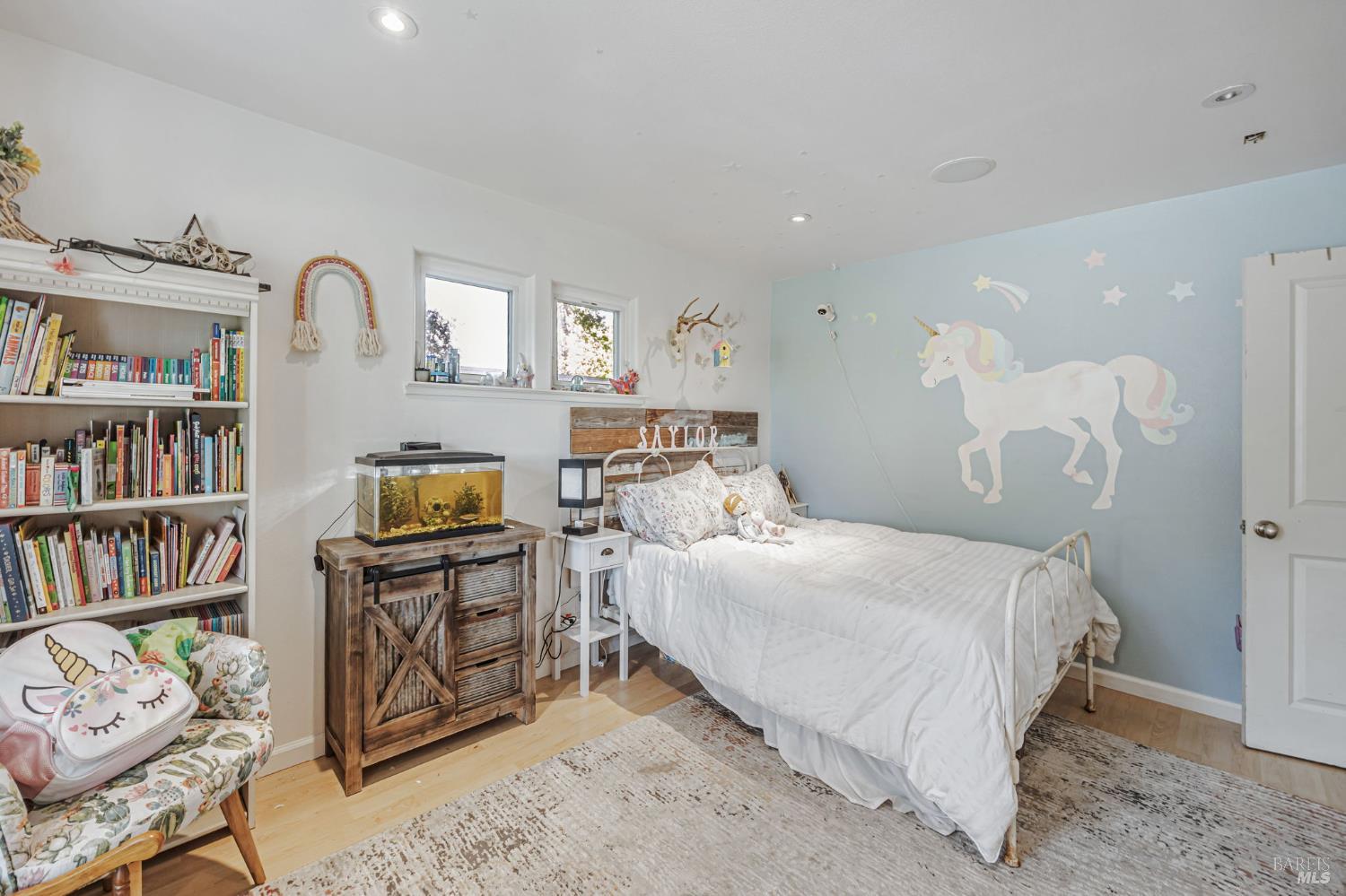 4100 Bisordi Lane Fulton, CA 95439 - Photo 34 of 75 a bedroom with a bed cabinets and a book shelf