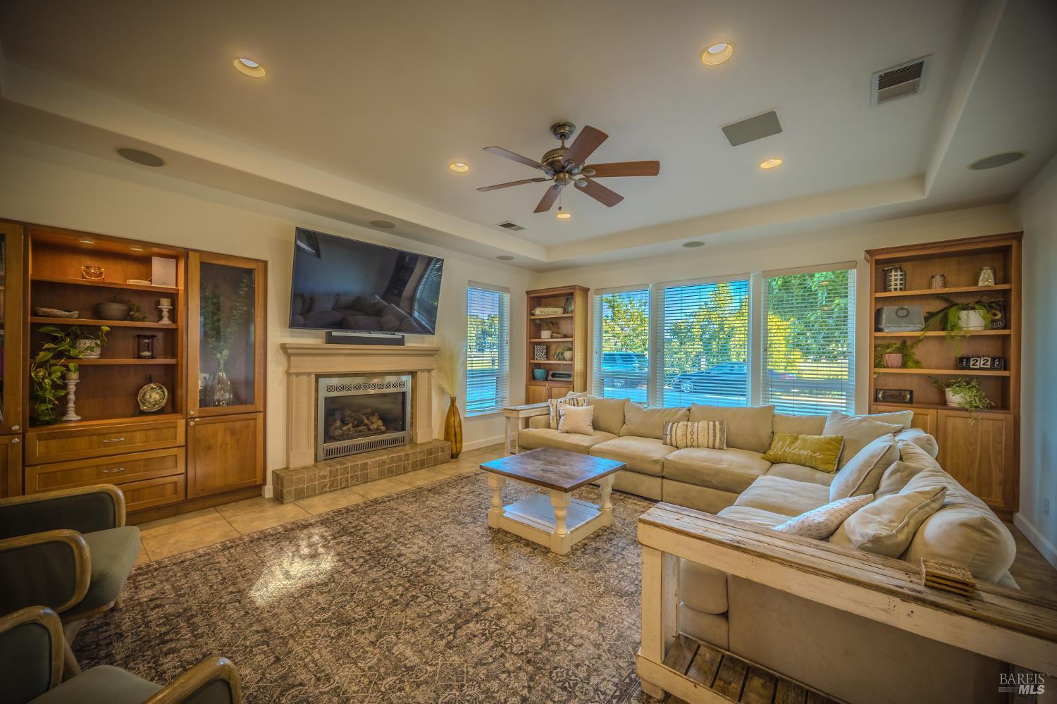 4100 Bisordi Lane Fulton, CA 95439 - Photo 38 of 77 a living room with furniture a fireplace and a flat screen tv
