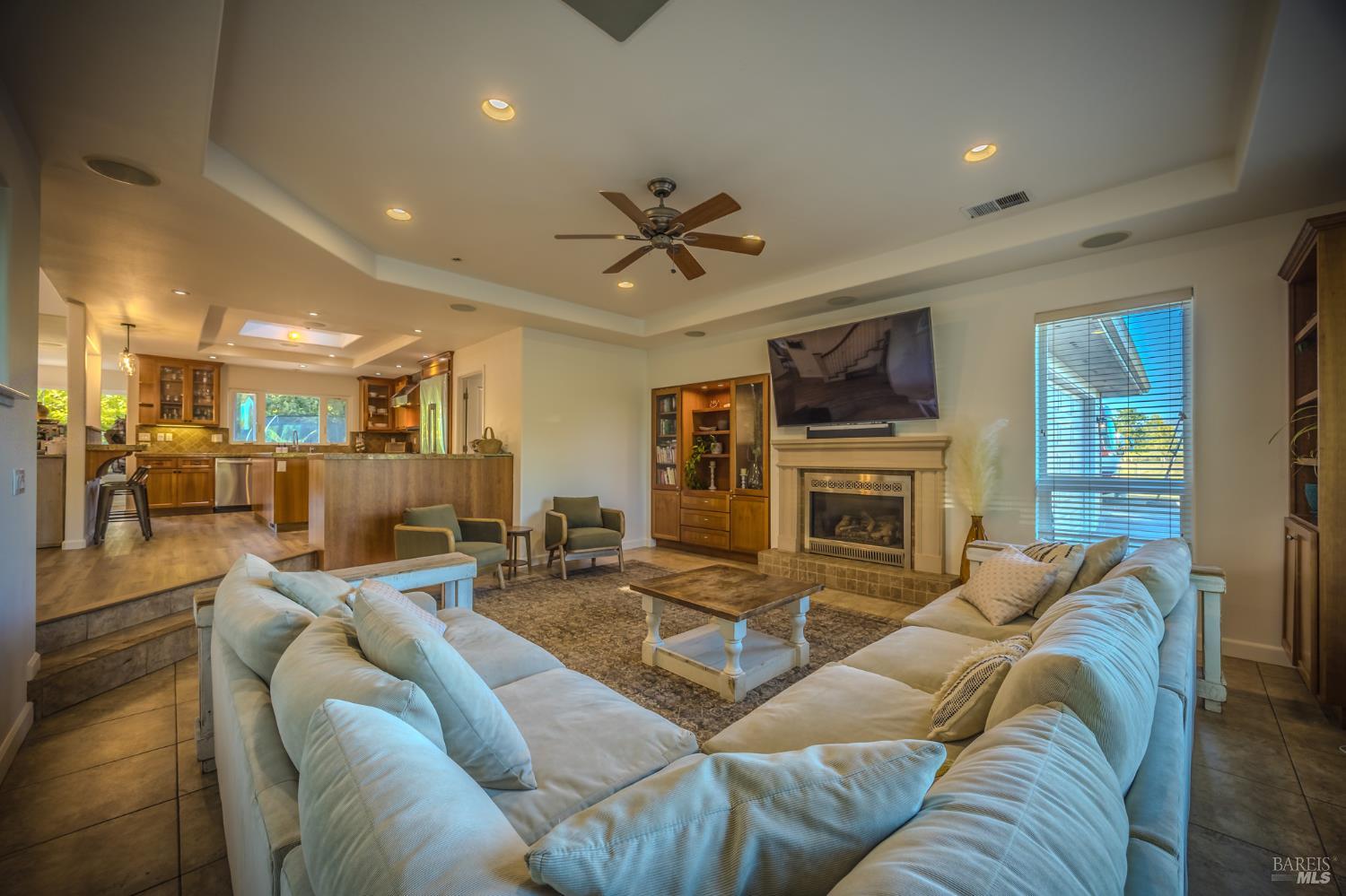 4100 Bisordi Lane Fulton, CA 95439 - Photo 40 of 77 a living room with furniture a fireplace and a flat screen tv