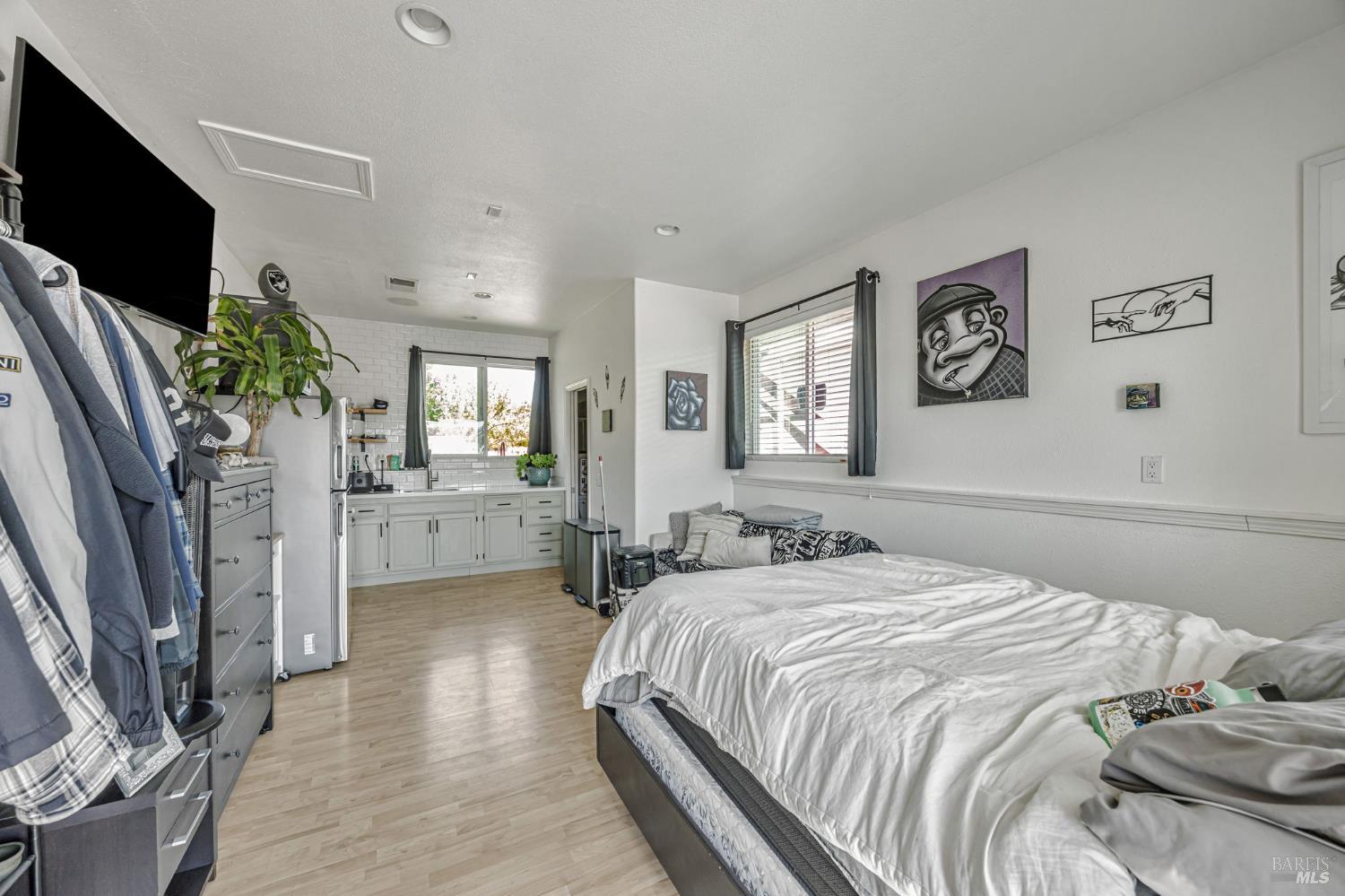 4100 Bisordi Lane Fulton, CA 95439 - Photo 47 of 75 a bedroom with a bed flat screen tv and windows