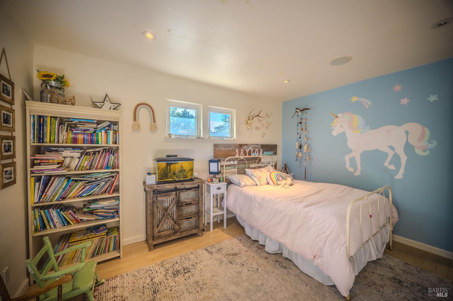 4100 Bisordi Lane Fulton, CA 95439 - Photo 62 of 77 a bedroom with a bed cabinets and a book shelf