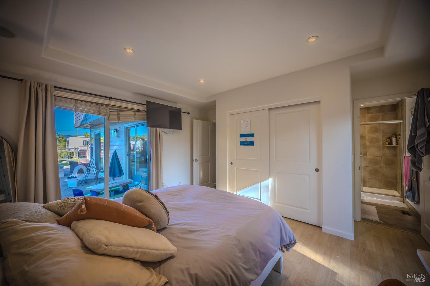 4100 Bisordi Lane Fulton, CA 95439 - Photo 65 of 77 a bedroom with a large bed and a large window