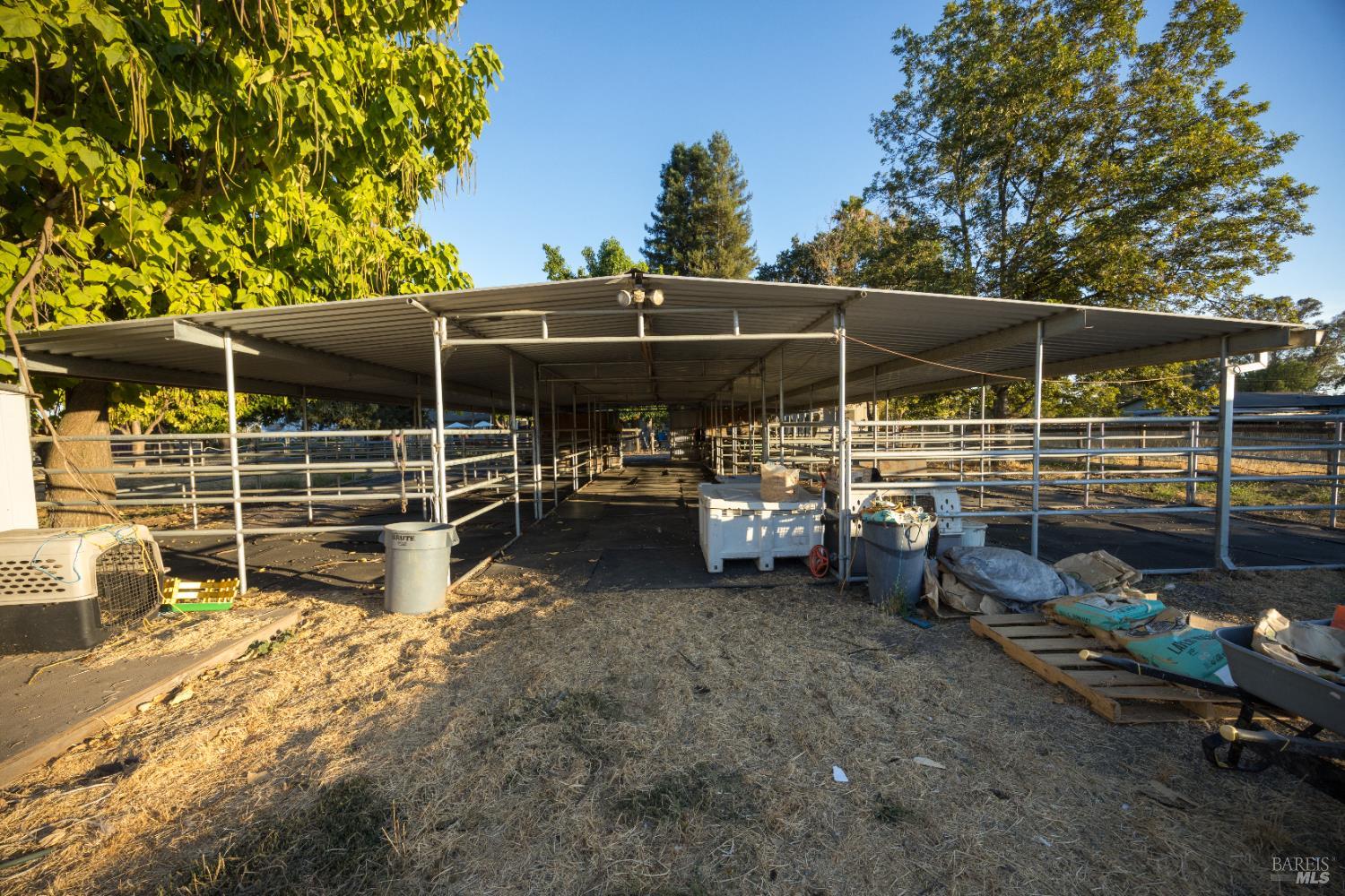 4100 Bisordi Lane Fulton, CA 95439 - Photo 7 of 75 a view of a garage with table and chairs under an umbrella