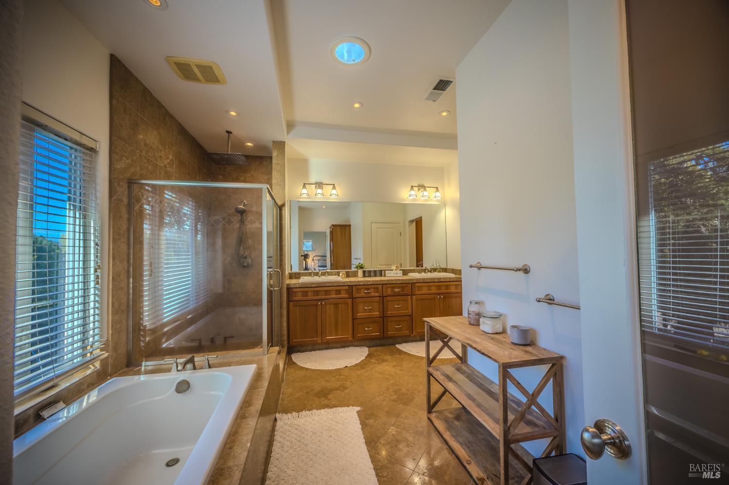 4100 Bisordi Lane Fulton, CA 95439 - Photo 76 of 77 a bathroom with a tub sink and mirror