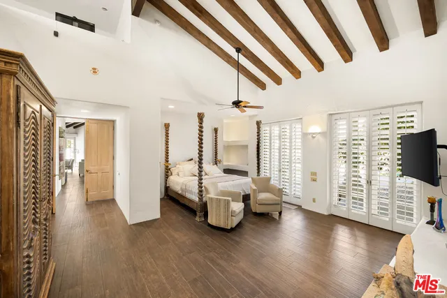 a bedroom with furniture and a window