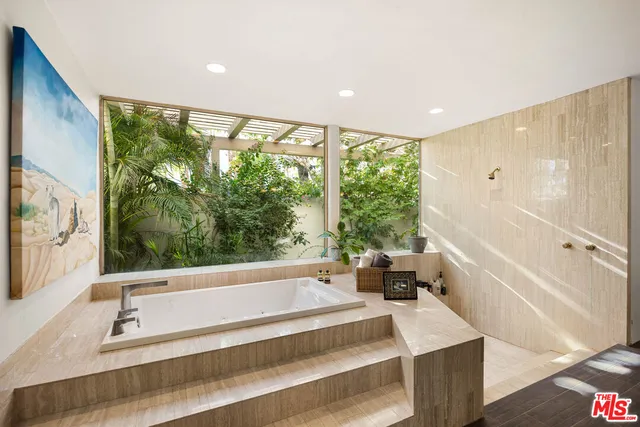 a bathroom with a sink a mirror and a bathtub