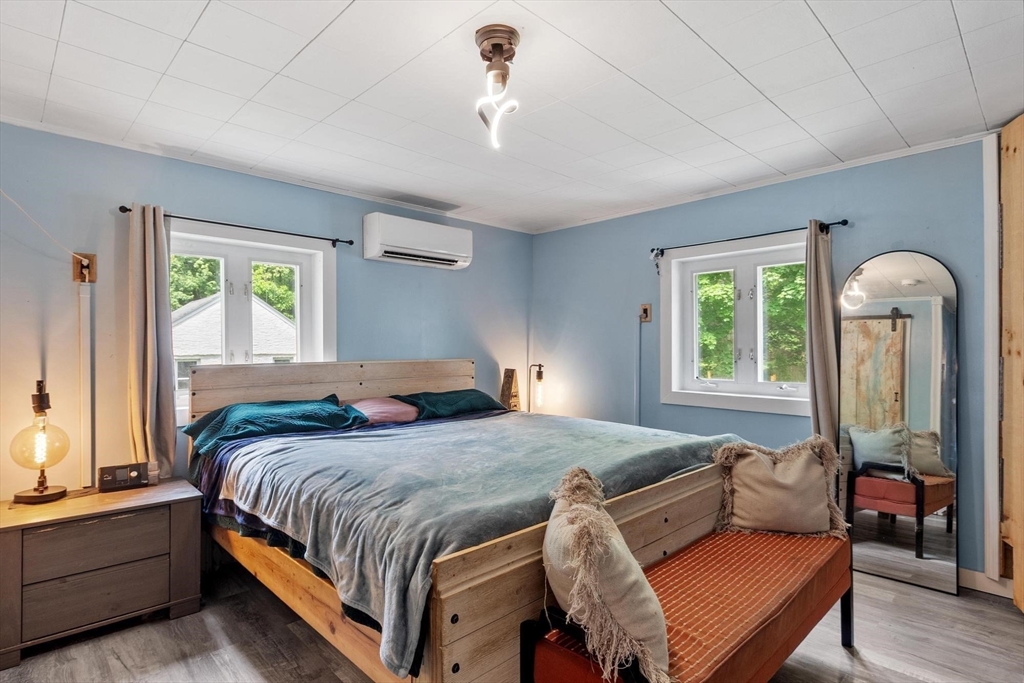 144 Bailey Road Holden, MA 01520 - Photo 14 of 42 a bedroom with a bed couch and window
