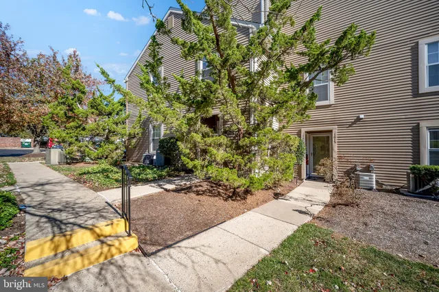 a backyard of a house with outdoor seating